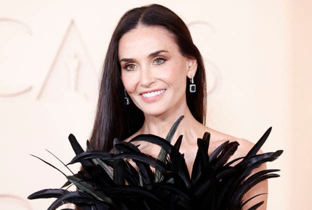 Demi Moore arrives on the red carpet for the 98th annual Academy Awards in the Hollywood section of Los Angeles on Sunday, March 15, 2026. Conan O Brien will host the Oscars for the second consecutive year.  LAP202603153001 JOHNxANGELILLO