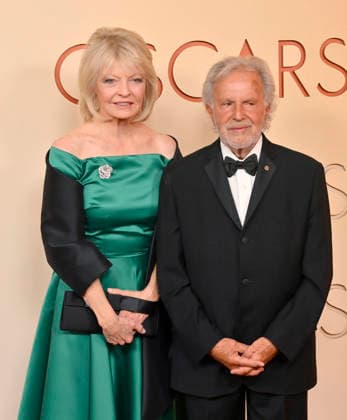 Nancy Hult Ganis and Sid Ganis arrive on the red carpet for the 98th annual Academy Awards in the Hollywood section of Los Angeles on Sunday, March 15, 2026. Conan O Brien will host the Oscars for the second consecutive year.  LAP20260315320 JIMxRUYMEN