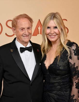 Mike Medavoy and Irena Medavoy arrive on the red carpet for the 98th annual Academy Awards in the Hollywood section of Los Angeles on Sunday, March 15, 2026. Conan O Brien will host the Oscars for the second consecutive year.  LAP202603153242 JIMxRUYMEN