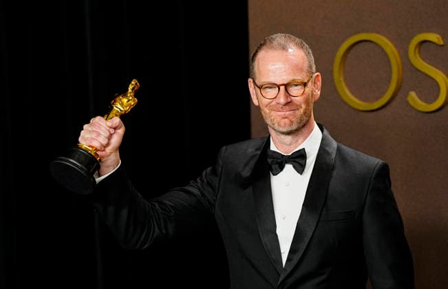 Joachim Trier celebrates in the press photo room after winning the Best International Feature Film Oscar for Sentimental Value-Norway during the 98th annual Academy Awards in the Hollywood section of Los Angeles on Sunday, March 15, 2026.  LAP20260315399 BONNIExCASH