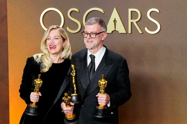 Paul Thomas Anderson and Sarah Murphy celebrate in the press photo room after winning multiple Oscars including the Best Picture award for One Battle After Another during the 98th annual Academy Awards in the Hollywood section of Los Angeles on Sunday, March 15, 2026.  LAP2026031541333 BONNIExCASH