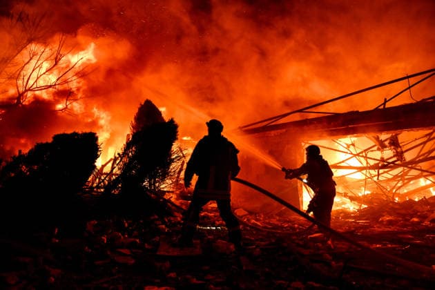 RECORD DATE NOT STATED Rescuers extinguish a fire in the private sector following a Russian drone attack, Zaporizhzhia, Ukraine, on March 16, 2026. Russian forces attacked the city with strike drones overnight into March 16, damaging residential houses and causing fires at the sites of impact. According to preliminary reports, three civilians were injured, including an 18-year-old man and two women aged 48 and 81 (Photo by Dmytro Smolienko Ukrinform) Russian drones attack Zaporizhzhia, private sector damaged  Copyright: xDmytroxSmolienkox