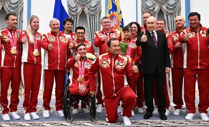 Russia Putin Paralympic Athletes 9126936 19.03.2026 Russian President Vladimir Putin poses for a group photo with participants during a state awards ceremony for the Russian medalists of the Milano Cortina 2026 Winter Paralympic Games at the Kremlin in Moscow, Russia. Sergey Bobylev Sputnik Moscow Russia  Copyright: xSergeyxBobylevx