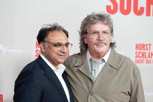 from left Walid Nakschbandi, Head of the Filmstiftung NRW, Hape KERKELING in the role of Horst Schlaemmer, Schlämmer, red carpet, red carpet show, arrival, film premiere HORST SCHLAEMMER SUCHT DAS GLUECK, Schlämmer, at the Lichtburg in Essen, 19 03 2026
