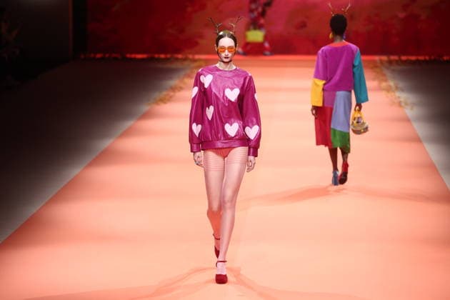 Agatha Ruiz de la Prada fashion show at Mercedes Benz Fashion Week in Madrid A model during an Agatha Ruiz de la Prada fashion show at Mercedes Benz Fashion Week, March 20, 2026, in Madrid Spain The Madrid-based designer Agatha Ruiz de la Prada, a Spanish fashion icon for her pop universe of vibrant colors and geometric shapes, presents her spring summer 2026 collection at MBFWMadrid, Spanish fashion icon for her pop universe of vibrant colors and geometric shapes, presents at MBFWMadrid her spring summer collection 2026, created with the support of artificial intelligence and faithful to her unmistakable hearts and playful volumes at IFEMA Madrid 20 MARCH 2026 Madrid Madrid Madrid Spain  Copyright: xEduardoxParrax 7383004