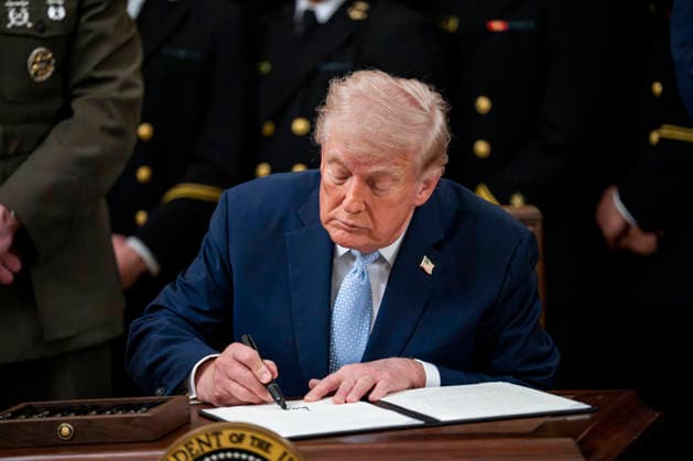 President Donald Trump signs an executive order instructing the Federal Communications Commission and Secretary of Commerce to ensure the Army-Navy Football Game has an exclusive broadcast window during the Commander in Chief s Trophy to the Navy Midshipmen football team during a ceremony in the East Room of the White House in Washington, DC on Friday, March 20, 2026. The award is presented annually to the winner of the football competition between the Navy, Air Force and Army. Navy has won the trophy back to back years and 13 times over the last 23 years.  WAP202603201161 BONNIExCASH
