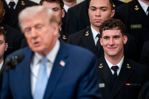 Navy Midshipmen Quarterback Blake Horvath looks on as President Donald Trump speaks during the Commander in Chief s Trophy ceremony in the East Room of the White House in Washington, DC on Friday, March 20, 2026. The award is presented annually to the winner of the football competition between the Navy, Air Force and Army. Navy has won the trophy back to back years and 13 times over the last 23 years.  WAP202603201147 BONNIExCASH