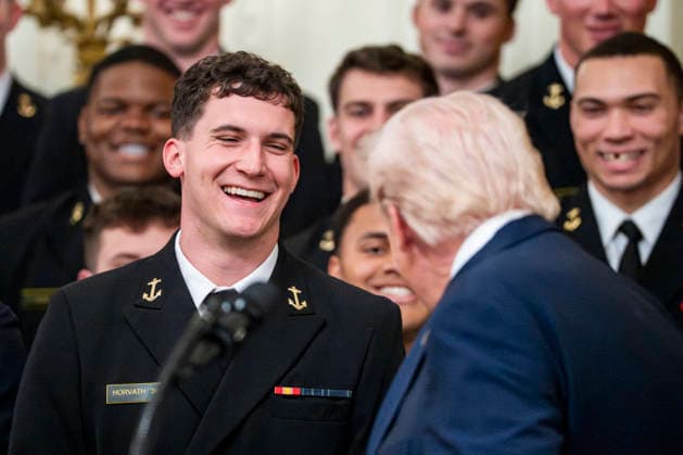 President Donald Trump greets Navy Midshipmen Quarterback Blake Horvath during the Commander in Chief s Trophy ceremony in the East Room of the White House in Washington, DC on Friday, March 20, 2026. The award is presented annually to the winner of the football competition between the Navy, Air Force and Army. Navy has won the trophy back to back years and 13 times over the last 23 years.  WAP202603201155 BONNIExCASH