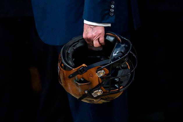 President Donald Trump holds a Navy Midshipmen football helmet during the Commander in Chief s Trophy ceremony in the East Room of the White House in Washington, DC on Friday, March 20, 2026. The award is presented annually to the winner of the football competition between the Navy, Air Force and Army. Navy has won the trophy back to back years and 13 times over the last 23 years.  WAP202603201167 BONNIExCASH