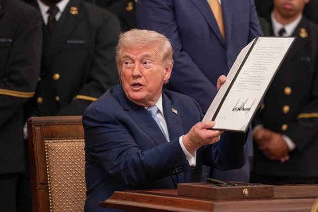 March 20, 2026, Washington, District Of Columbia, USA: President DONALD TRUMP signs an executive order to reserve a four hour block on the second Saturday in December for the Army Navy football game during an event in the East Room of the White House Washington USA - ZUMAs365 20260320_znp_s365_022 Copyright: xJoeyxSussmanx