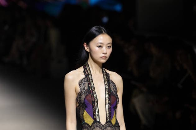 Custo Barcelona fashion show at Mercedes Benz Fashion Week Madrid A model during the Custo Barcelona fashion show at Mercedes Benz Fashion Week Madrid, March 20, 2026, in Madrid Spain The Catalan firm, led by designer Custo Dalmau, presents at the MBFWMadrid its new collection We Own the Light, a proposal of free spirit and vibrant graphics that claims the light as a symbol of energy and identity on the great catwalk of IFEMA Madrid 20 MARCH 2026 FASHION SHOW DESIGNER CUSTO MBFW Madrid Madrid Madrid Spain  Copyright: xRicardoxRubiox 7383539