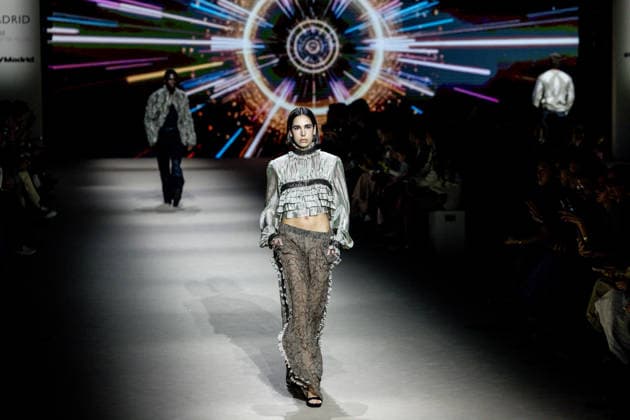 Custo Barcelona fashion show at Mercedes Benz Fashion Week Madrid A model during the Custo Barcelona fashion show at Mercedes Benz Fashion Week Madrid, March 20, 2026, in Madrid Spain The Catalan firm, led by designer Custo Dalmau, presents at the MBFWMadrid its new collection We Own the Light, a proposal of free spirit and vibrant graphics that claims the light as a symbol of energy and identity on the great catwalk of IFEMA Madrid 20 MARCH 2026 FASHION SHOW DESIGNER CUSTO MBFW Madrid Madrid Madrid Spain  Copyright: xRicardoxRubiox 7383542