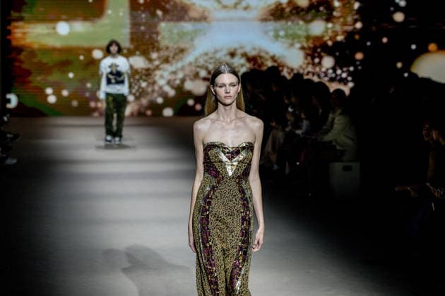 Custo Barcelona fashion show at Mercedes Benz Fashion Week Madrid A model during the Custo Barcelona fashion show at Mercedes Benz Fashion Week Madrid, March 20, 2026, in Madrid Spain The Catalan firm, led by designer Custo Dalmau, presents at the MBFWMadrid its new collection We Own the Light, a proposal of free spirit and vibrant graphics that claims the light as a symbol of energy and identity on the great catwalk of IFEMA Madrid 20 MARCH 2026 FASHION SHOW DESIGNER CUSTO MBFW Madrid Madrid Madrid Spain  Copyright: xRicardoxRubiox 7383540