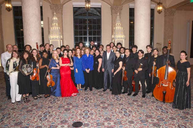 Queen Sofia of Spain (C) and the Consul General of Spain in Miami, Belen Alfaro Hernandez (C-L), pose with members of the Florida International University (FIU) orchestra and the Nicole Wertheim School of Musicduring the event Florida, Cuba and the Caribbean in the American Revolution at the Freedom Tower in Miami, Florida, USA, 20 March 2026. Queen Sofia of Spain inaugurated America&Spain250 in Miami, an academic initiative commemorating the 250th anniversary of the founding of the United States and highlighting Spain s contributions to the American Revolution and the shared history between the two countries, as part of her three-day visit to Florida. Queen Sofia inaugurates America&Spain250 in Miami to celebrate the 250th anniversa  Copyright: xGiorgioxVierax USA9258 20260321-55019768121_1