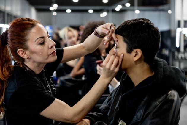 Fely Campos fashion show at Mercedes Benz Fashion Week Make-up artist applies make-up to a model backstage at Fely Campos fashion show on the occasion of Mercedes Benz Fashion Week, March 21, 2026, in Madrid Spain Fely Campo is a firm that stands out for the precision of its patterns and its refined style Its fashion show is part of the Mercedes Benz Fashion Week Madrid, the main Spanish fashion show organized by IFEMA, which brings together established firms and new talent MARCH 21, 2026 FASHION Madrid Madrid Spain  Copyright: xRicardoxRubiox 7384953