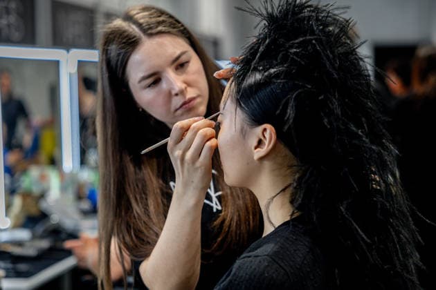 Fely Campos fashion show at Mercedes Benz Fashion Week Make-up artist applies make-up to a model backstage at Fely Campos fashion show on the occasion of Mercedes Benz Fashion Week, March 21, 2026, in Madrid Spain Fely Campo is a firm that stands out for the precision of its patterns and its refined style Its fashion show is part of the Mercedes Benz Fashion Week Madrid, the main Spanish fashion show organized by IFEMA, which brings together established firms and new talent MARCH 21, 2026 FASHION Madrid Madrid Spain  Copyright: xRicardoxRubiox 7384956
