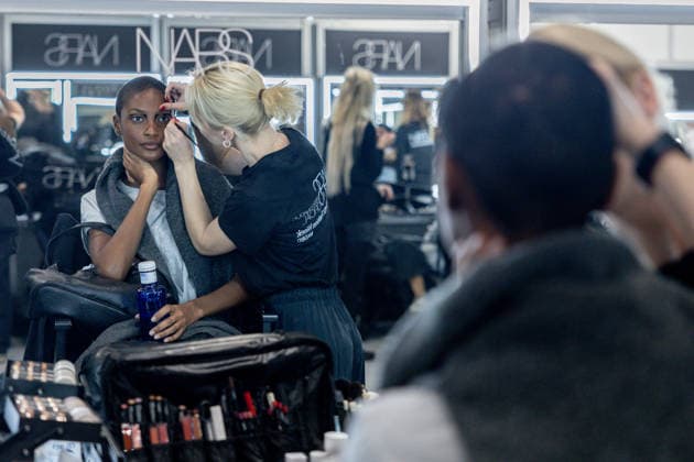 Fely Campos fashion show at Mercedes Benz Fashion Week Make-up artist applies make-up to a model backstage at Fely Campos fashion show on the occasion of Mercedes Benz Fashion Week, March 21, 2026, in Madrid Spain Fely Campo is a firm that stands out for the precision of its patterns and its refined style Its fashion show is part of the Mercedes Benz Fashion Week Madrid, the main Spanish fashion show organized by IFEMA, which brings together established firms and new talent MARCH 21, 2026 FASHION Madrid Madrid Spain  Copyright: xRicardoxRubiox 7384957