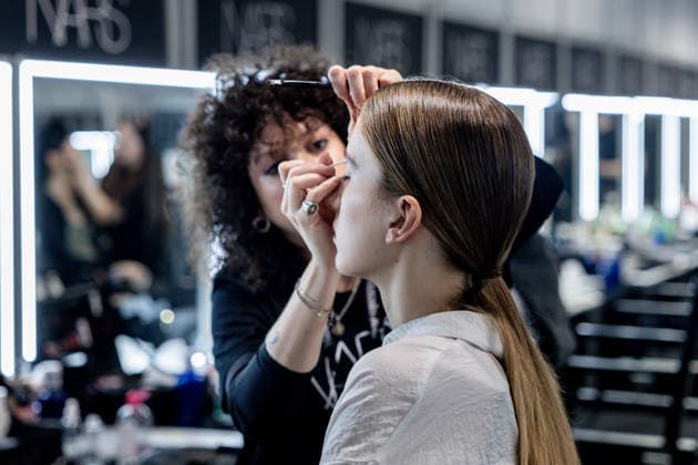 Fely Campos fashion show at Mercedes Benz Fashion Week Make-up artist applies make-up to a model backstage at Fely Campos fashion show on the occasion of Mercedes Benz Fashion Week, March 21, 2026, in Madrid Spain Fely Campo is a firm that stands out for the precision of its patterns and its refined style Its fashion show is part of the Mercedes Benz Fashion Week Madrid, the main Spanish fashion show organized by IFEMA, which brings together established firms and new talent MARCH 21, 2026 FASHION Madrid Madrid Spain  Copyright: xRicardoxRubiox 7384954