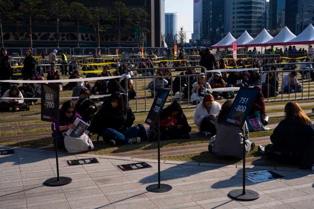 March 21, 2026, Seoul, South Korea: People wait for K-pop boy band BTS to perform for the first time in four years in a return from a hiatus due to its membersÃ¢â‚¬â ¢ compulsory military service, in a free concert held on Saturday, March 21, 2026 to promote their new album ARIRANG in Gwanghwamun Square in Seoul, South Korea Seoul South Korea  - ZUMAh163 20260321_znp_h163_029 Copyright: xJintakxHanx