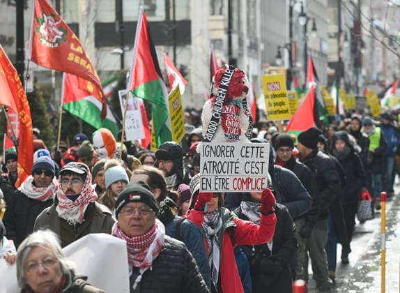 March 21, 2026, Montreal, Pq, Canada: People take part in a protest against the U.S. and Israeli war against Iran and Lebanon in Montreal, Saturday, March 21, 2026. Montreal Canada  - ZUMAc35_ 20260321_zaf_c35_062 Copyright: xGrahamxHughesx