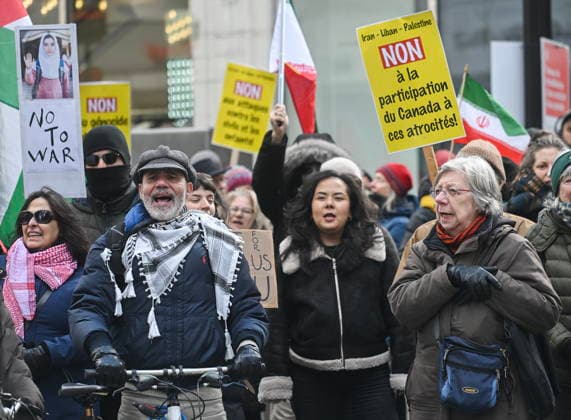 March 21, 2026, Montreal, Pq, Canada: People take part in a protest against the U.S. and Israeli war against Iran and Lebanon in Montreal, Saturday, March 21, 2026. Montreal Canada  - ZUMAc35_ 20260321_zaf_c35_063 Copyright: xGrahamxHughesx