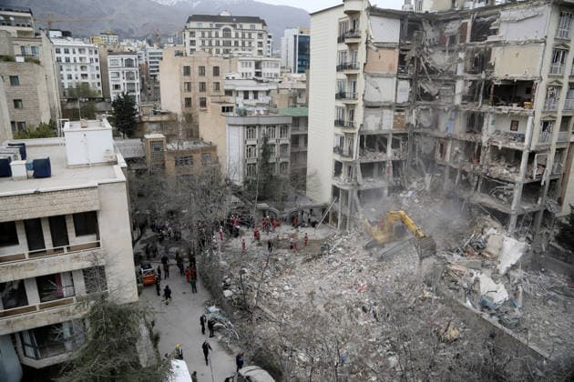 Airstrikes cause heavy damage in Tehran TEHRAN, IRAN - MARCH 23: Civil defense and search and rescue teams continue operations in the area after U.S. and Israeli strikes targeted the Enderzgu district of the Iranian capital Tehran at dawn, causing severe damage as half of an eight-story building collapsed and the remaining part became unusable, while nearby structures were heavily damaged and many vehicles were rendered inoperable, on March 23, 2026. Fatemeh Bahrami Anadolu Tehran Iran. Editorial use only. Please get in touch for any other usage.  Copyright: x2026xAnadoluxFatemehxBahramix