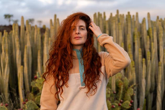Portrait of red haired woman at sunset in desert with cactus model released, Symbolfoto, AFVF09448