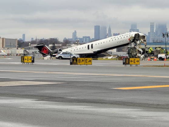 March 23, 2026, East Elmhurst, New York, United States Of America: NEW YORK, NEW YORK - MARCH 23: An Air Canada Express plane sits on the tarmac after it collided with a fire truck on the tarmac at LaGuardia Airport on March 23, 2026 in New York City. Two people are believed to have been killed in the late-night accident, with dozens injured. The plane had landed from a flight from Montreal....People: Air Canada Express plane, Fire Truck East Elmhurst United States Of America - ZUMAs214 20260323_aaa_s214_001 Copyright: xSMGx