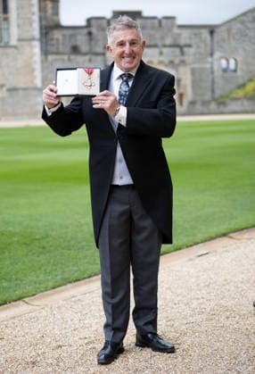. 24 03 2026. Windsor , United Kingdom. Former Welsh Rugby player Jonathan Davis with his CBE after an Investiture at Windsor Castle, United Kingdom.  xStephenxLockx xi-Imagesx IIM-26659-0001