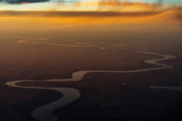 Creative Highlights World Winding river seen from airplane during sunset flight. United States, Idaho, Idaho Falls CR_TYRI260324A-1988657-01
