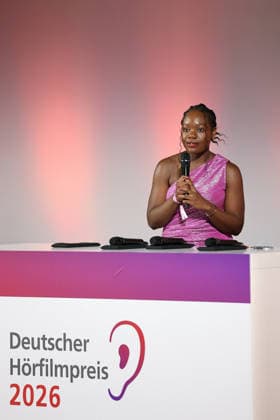 German Audio Film Award, Award Ceremony at the Colosseum Cinema, Berlin, 24 03 2026 Kathy Etoa gives the laudatory speech for the Documentary category at the German Audio Film Award Ceremony at the Colosseum Cinema in Berlin on 24 03 2026 Berlin Cinema Collosseum Copyright: xRenÃ xduxVinagex