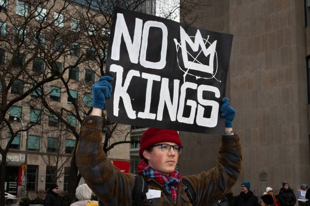 No Tyrants rally in Toronto, Canada - 28 Mar 2026 A protest sign that reads MAKE AMERICA DEMOCRATIC AGAIN at the No Tyrants rally in Toronto. Hundreds of demonstrators gathered in Toronto on Saturday for the No Tyrants rally, the name used in countries with constitutional monarchies for the broader No Kings movement opposing U.S. President Donald Trump. Organized in part by Democrats Abroad, the event drew a large crowd that included many self-identified American citizens living in Canada. Marchers sang and carried signs as they walked through downtown Toronto streets near the U.S. Consulate. The Toronto action was part of a global day of protest, with more than 3,100 events organized across all 50 U.S. states and sister demonstr Copyright: xStaceyxNewmanx xSOPAxImagesx StaceyNewman-8218