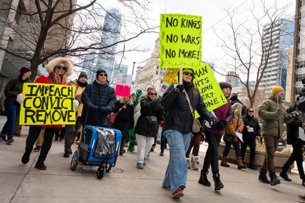 No Tyrants rally in Toronto, Canada - 28 Mar 2026 Protesters and attendees march together northbound on University Avenue in Toronto for the ‘No Tyrants’ rally held in Toronto. Hundreds of demonstrators gathered in Toronto on Saturday for the No Tyrants rally, the name used in countries with constitutional monarchies for the broader No Kings movement opposing U.S. President Donald Trump. Organized in part by Democrats Abroad, the event drew a large crowd that included many self-identified American citizens living in Canada. Marchers sang and carried signs as they walked through downtown Toronto streets near the U.S. Consulate. The Toronto action was part of a global day of protest, with more than 3,100 events organized across all 50 Copyright: xStaceyxNewmanx xSOPAxImagesx StaceyNewman-8472