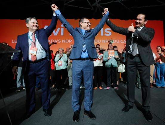 March 29, 2026, Winnipeg, Manitoba, CANADA: Avi Lewis, centre, who was proclaimed as the new leader of the NDP, celebrates with former interim leader Don Davies, left, and Manitoba premier Wab Kinew at the party convention in Winnipeg Sunday, March 29, 2026. Winnipeg CANADA - ZUMAc35_ 20260329_zaf_c35_029 Copyright: xJohnxWoodsx