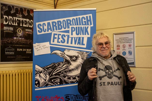 Scarborough Punk Festival 2026, UK - 29 Mar 2026 Front man of the UK Subs, Charlie Harper poses for a photo by the festival poster at the Scarborough Spa building. Hundreds of punk rock fans gathered in Scarborough Spa in Yorkshire county, England for the two days long punk rock festival. Scarborough United Kingdom Copyright: xKrisztianxElekx xSOPAxImagesx SSS_20260329_PUNK_FEST_0011005235