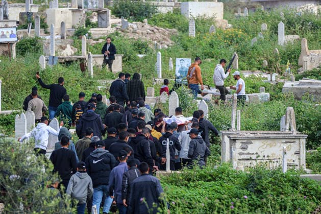 Funeral ceremony of 3 Palestinians killed in an Israeli airstrike on Gaza GAZA CITY, GAZA - MARCH 30: People attend funeral ceremony of three Palestinian members of the Qassam Brigades, who died following the Israeli attack, at the Shafi’i Mosque in Gaza City, Gaza on March 30, 2026. Khames Alrefi Anadolu Gaza City Gaza. Editorial use only. Please get in touch for any other usage.  Copyright: x2026xAnadoluxKhamesxAlrefix