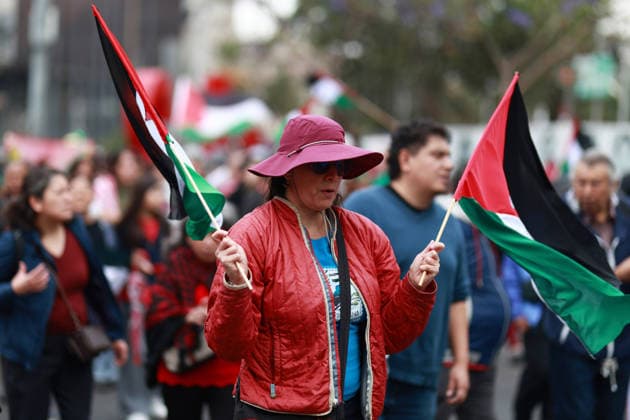 Demonstrators hold a rally marking Palestinian Land Day in Mexico City MEXICO CITY, MEXICO - MARCH 30: A demonstrator holds Palestinian flags during a rally, marking Palestinian Land Day, at reforma avenue, in Mexico City, Mexico on March 30, 2026. Daniel Cardenas Anadolu Mexico City Mexico. Editorial use only. Please get in touch for any other usage.  Copyright: x2026xAnadoluxDanielxCardenasx