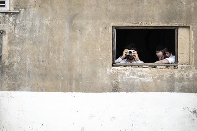 Missile debris damage central Israel after Iranian retaliation BNEI BRAK, ISRAEL – MARCH 31: A resident takes a photograph while another looks on from a window of a residential building damaged after missile debris struck the area following an Iranian retaliatory attack on Tel Aviv, Israel on March 31, 2026. The impact caused structural damage to the building and nearby structures in Bnei Brak. Mostafa Alkharouf Anadolu Tel Aviv Israel. Editorial use only. Please get in touch for any other usage.  Copyright: x2026xAnadoluxMostafaxAlkharoufx