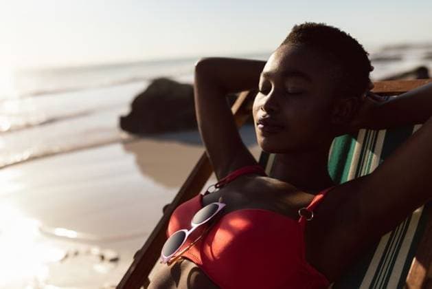 Relaxing on beach, woman in red bikini sunbathing on deck chair by ocean, copy space Relaxing on beach, woman in red bikini sunbathing on deck chair by ocean, copy space. Vacation, relaxation, leisure, tropical, summer, seaside, model released, , property released, , 15.03.2019, 5847298.jpg, people,relaxing,woman,bikini,sunbathing,deck,chair,ocean,vacation,relaxation,copy space,leisure,tropical,summer,seaside,beach,coast,waves,sand,resort,travel,getaway,sunshine,holiday,outdoor,lifestyle,beauty,female,fitness,health,nature,scenery,paradise,enjoyment,serenity,tranquility,sun,warm,oceanfront,horizon,blue,water,leisurewear,swimwear,sunhat,sunglasses,tan,palm,tropical plants,vacationer,seaside resort Mid Adult,Man,Male,Mixed-Race