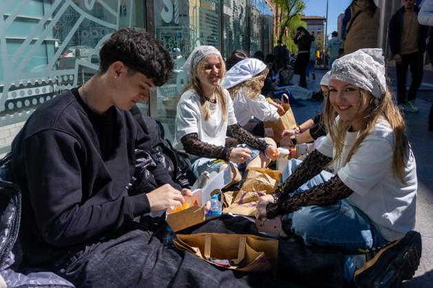 April 1, 2026, Madrid, Spain: A group of Rosalia fans sit and eat while waiting for the doors of the Palacio de los Deportes in Madrid to open. Rosalia fans gathered around the Palacio de los Deportes ahead of the second of four concerts the Catalan singer Rosalia will give in Madrid. Madrid Spain  - ZUMAs197 20260401_aaa_s197_080 Copyright: xDavidxCanalesx