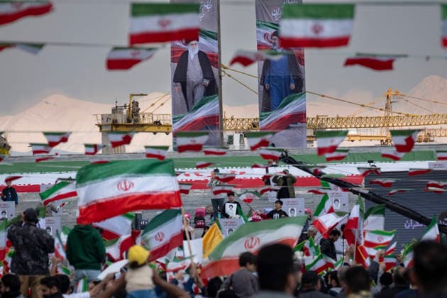 Pro-Government Demonstrators Mark Islamic Republic Day Pro-government demonstrators wave national flags beneath the portraits of late Supreme Leader Ayatollah Ali Khamenei and the new Supreme Leader Ayatollah Mojtaba Khamenei during a flag ceremony marking Iran s Islamic Republic National Day in the Abbasabad Cultural and Tourist Area in central Tehran, on April 1, 2026. This event takes place amid U.S.-Israeli military operations in Iran. Forty-seven years ago, Iranians voted yes in a referendum for the Islamic Republic regime. Tehran Iran  Copyright: xMortezaxNikoubazlx originalFilename: nikoubazl-progover260401_npwfJ.jpg