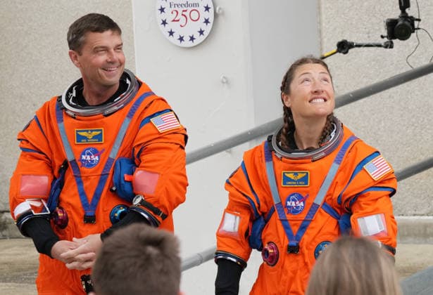The Artemis II crew commander Reid Wiseman (L) stands with mission specialist Christina Koch as they walkout before boarding the Artemis rocket at Kennedy Space Center in Florida on Wednesday, April 1, 2026. The four-person crew, including Canadian Space Agency astronaut Jeremy Hansen and NASA astronaut Victor Glover, is scheduled to lift off later today at 6:24 p.m. Eastern and will be the first crew launch to circle the Moon in more than 50 years.  KSC20260401910 PATxBENIC