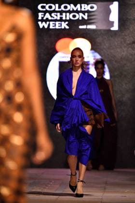(260402) -- COLOMBO, April 2, 2026 -- A model presents a creation during the Colombo Fashion Week in Colombo, Sri Lanka on April 1, 2026. The Colombo Fashion Week Summer 2026 takes place from April 1 to 4. The four-day event showcases creations from more than 30 designers. (Photo by Xinhua) SRI LANKA-COLOMBO-FASHION WEEK AjithxPerera 
