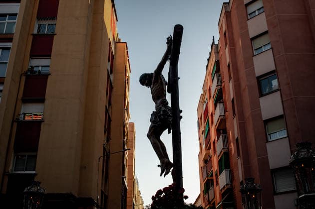April 3, 2026, El Prat De Llobregat, Spain: A statue of Jesus Christ on the cross is silhouetted between buildings as it is carried on a float during a Good Friday procession in El Prat de Llobregat, south of Barcelona, Spain. El Prat De Llobregat Spain - ZUMAb137 20260403_fap_b137_001 Copyright: xJordixBoixareux
