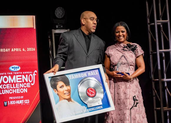 April 4, 2026, Philadelphia, Pennsylvania, United States: DERRICK CORBETT, Senior Vice President of Programming for iHeartMedia holds an award to present to TAMRON HALL, American broadcast journalist, television talk show host and author, receives the WDAS-FM tenth annual Women Of Excellence Legend award at the luncheon held at the Philadelphia Sheraton Philadelphia United States - ZUMArf1_ 20260404_zaf_rf1_030 Copyright: xRickyxFitchettx