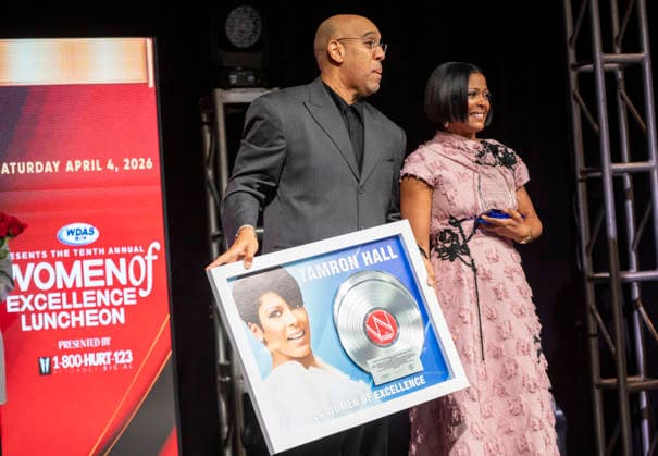 April 4, 2026, Philadelphia, Pennsylvania, United States: DERRICK CORBETT, Senior Vice President of Programming for iHeartMedia holds an award to present to TAMRON HALL, American broadcast journalist, television talk show host and author, receives the WDAS-FM tenth annual Women Of Excellence Legend award at the luncheon held at the Philadelphia Sheraton Philadelphia United States - ZUMArf1_ 20260404_zaf_rf1_027 Copyright: xRickyxFitchettx