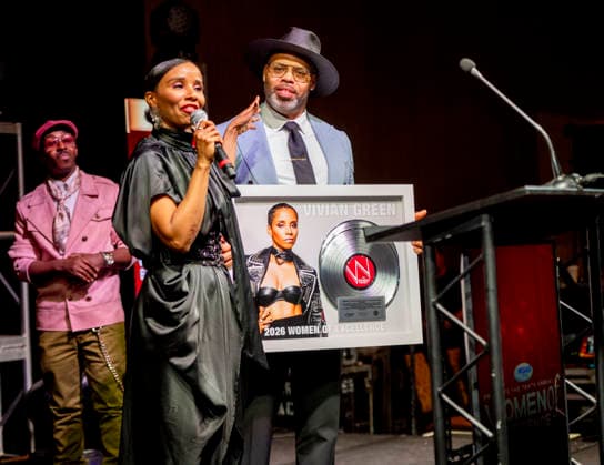 April 4, 2026, Philadelphia, Pennsylvania, United States: R&B singer, songwriter, VIVIAN GREEN, receives the Trailblazing award presented to her by ERIC ROBERSON, as rapper KWAME, looks on during the WDAS-FM tenth annual Women Of Excellence awards luncheon at the Philadelphia Sheraton Philadelphia United States - ZUMArf1_ 20260404_zaf_rf1_043 Copyright: xRickyxFitchettx
