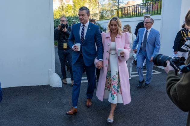 April 6, 2026, Washington, District Of Columbia, USA: Secretary of War Pete Hegseth and his wife walk into the white house before the White House Easter Egg Roll event Washington USA - ZUMAs365 20260406_znp_s365_017 Copyright: xJoeyxSussmanx