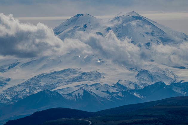 View over Mount Elbrus in Kabardino-Balkaria captures snow-covered peaks and clouds Copyright: MichaelxRunkel 1184-16294