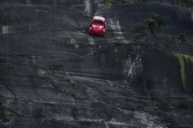 April 6, 2026, Squamish, Bc, CANADA: The shell of a Volkswagen Beetle hangs suspended on a cliff above the Sea-to-Sky Highway, in Squamish, B.C., on Monday, April 6, 2026. The vehicle appeared on the rock face last week with a large E on its roof, indicating that University of British Columbia engineering students were carrying on a long-standing tradition of placing the shell in difficult to reach locations. British Columbia s Environment Ministry is urging people to stay away from the area as they work on a plan to remove it. Squamish CANADA - ZUMAc35_ 20260406_zaf_c35_030 Copyright: xDarrylxDyckx